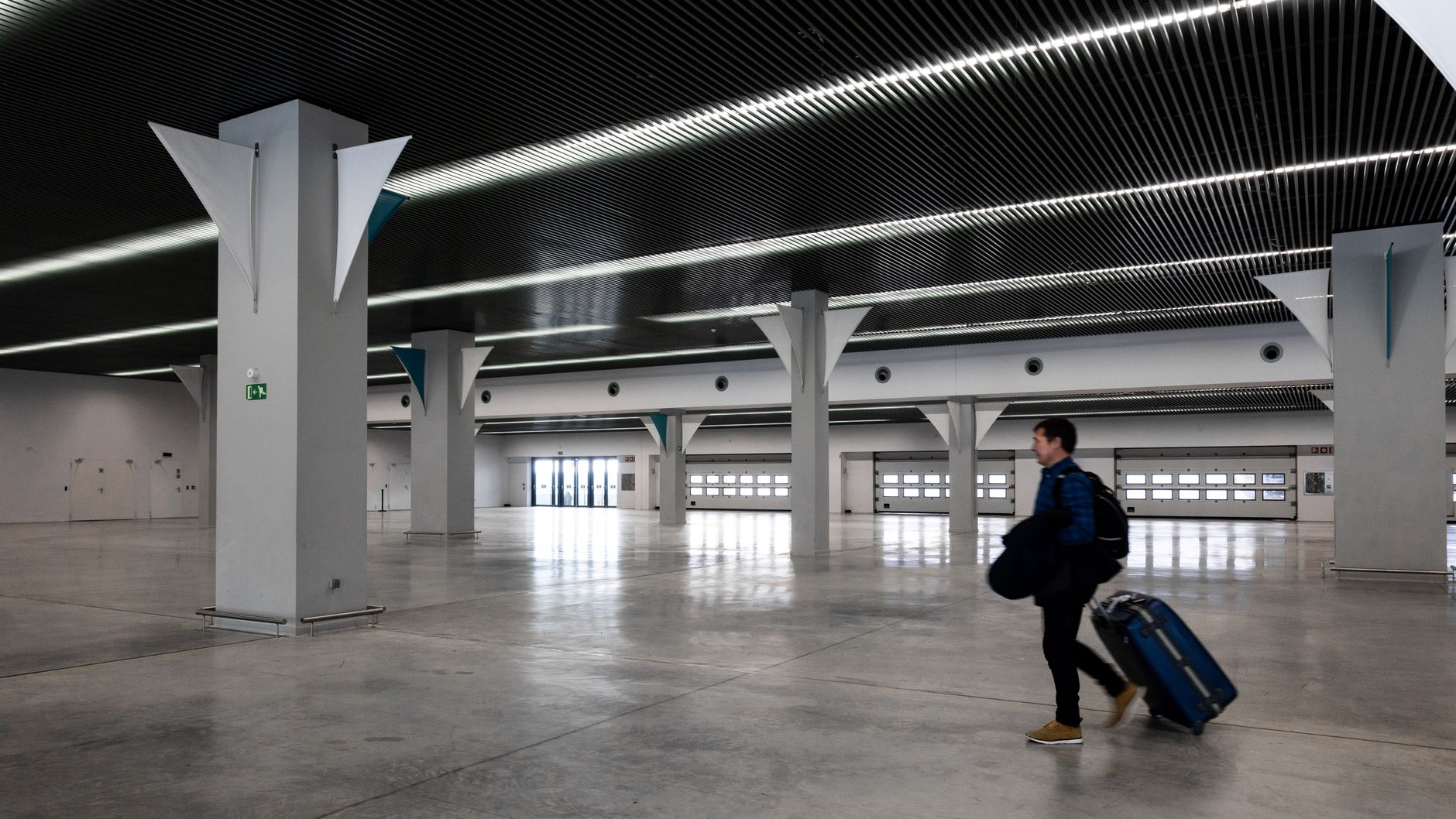 Traveller crossing an airport terminal